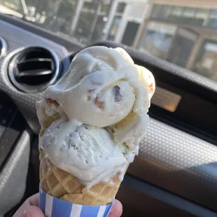 Toasted almond and marbled black raspberry on sugar cone