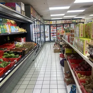 Produce front, refrigerated/frozen foods rear.