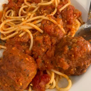 Partially devoured spaghetti and meatballs