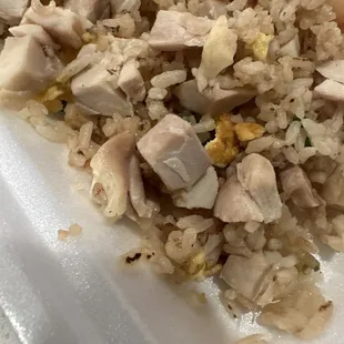 Boiled cubed chicken on top of the fried rice.