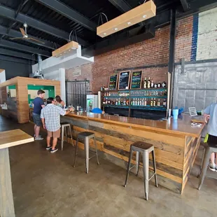 people standing at the bar