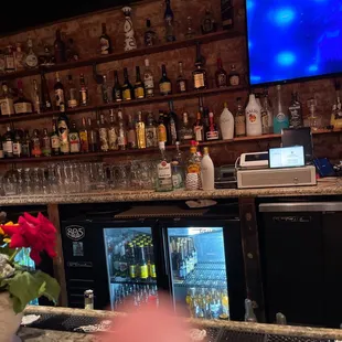 a bar with a television on the wall