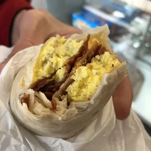a breakfast burrito in a wrap