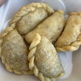 Chicken empanadas at top.  Beef at the bottom. Both come with sauce.