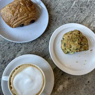 Latte, chocolate croissant, and spinach scone