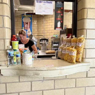 a woman behind the counter