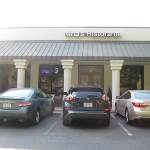 cars parked in front of a building