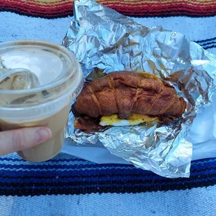 Pictured: a bacon egg and cheese on a crossaint &amp; an iced latte.
