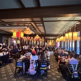 a large group of people sitting at tables