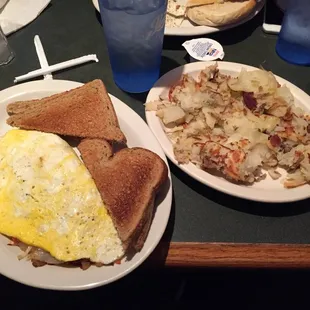 Veggie omelette with a side of home fries. So much food!!