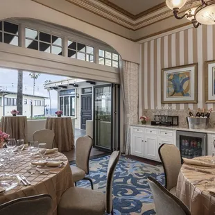 a dining room with a view of the ocean