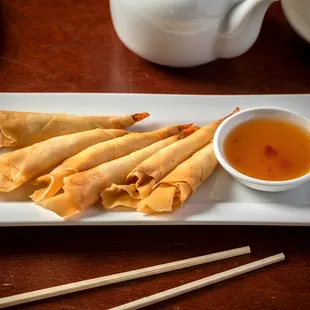 a plate of food and chopsticks