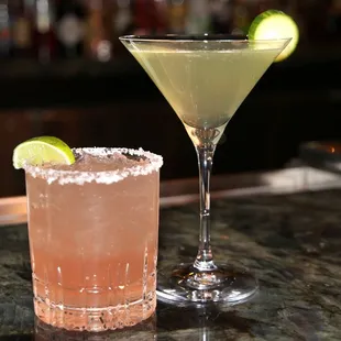 two cocktails on a bar