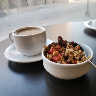 Coffee and customized yogurt parfait. Mine includes raisins, almonds, fresh strawberries and granola. Paired well with a misty windowiew