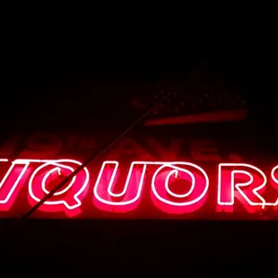 a neon sign in the dark