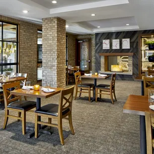 a dining area with tables and chairs