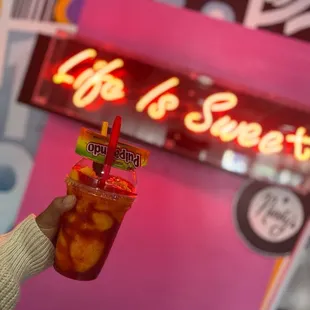 a person holding a drink