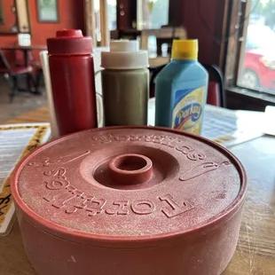 a red pot on a table
