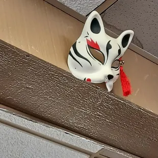 Another cat mask amongst the decor
