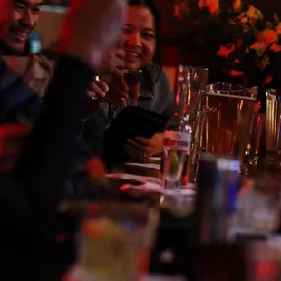 a group of people sitting at a bar