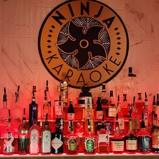 a variety of liquor bottles on a bar counter