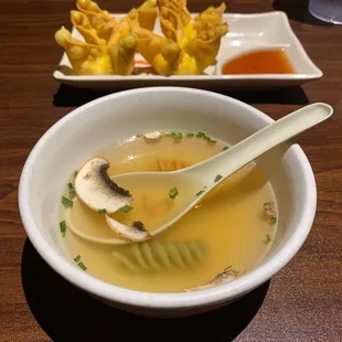 Chicken broth soup with mushrooms and crab rangoon