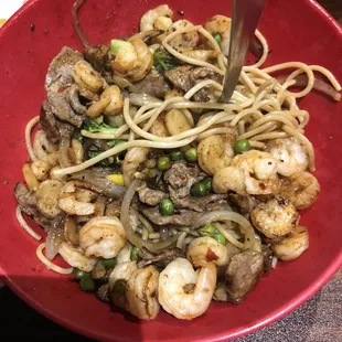 a bowl of noodles and shrimp