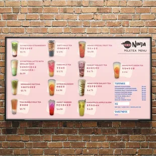 a menu on a brick wall