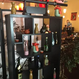 a shelf with bottles of wine