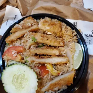 Per the Fried Rice w/Fried Chicken menu description, why is there pineapple, tomatoe and cucumber? Chicken is like dried rubber, inedible.