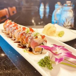 Godzilla roll ( spicy Tuna with Avocado top on salmon)