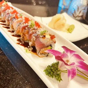 Godzilla roll ( spicy Tuna with Avocado top on salmon)