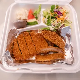 a meal in a styrofoam container