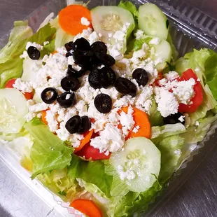 a salad in a plastic container