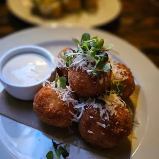 a plate of food with a side of sauce