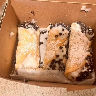 three pastries in a box