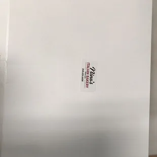 a white box with a sticker on it
