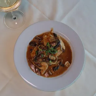 Nino&apos;s Authentic Italian Cuisine Dish with Eggplant, Marsala wine sauce, melted mozzarella.