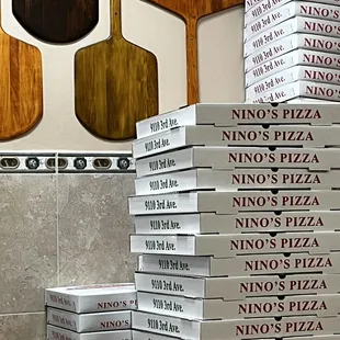 a stack of pizza boxes