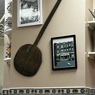 a pizza paddle and a picture of a woman