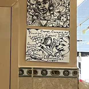 a couple of paintings on the wall