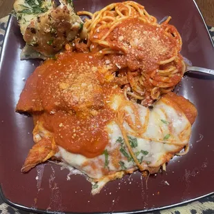Chicken Cutlet Parmigiana with Pasta and garlic knots.