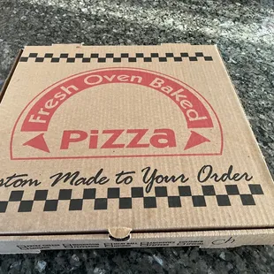a pizza box on a counter