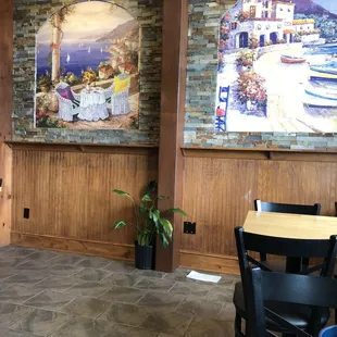 a dining area with tables and chairs