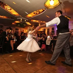 a bride and groom dancing