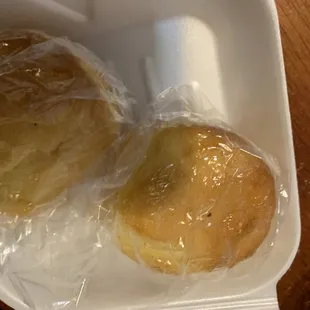 two buns wrapped in plastic