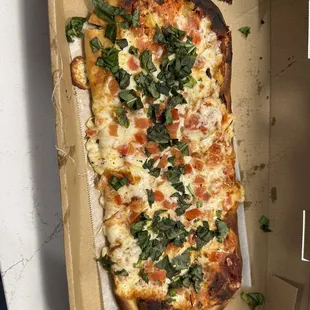 a pizza in a cardboard box