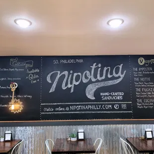 a chalkboard on the wall of a restaurant