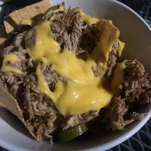 Piled high pork nachos