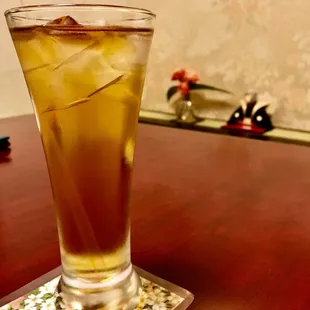 a glass of iced tea on a table